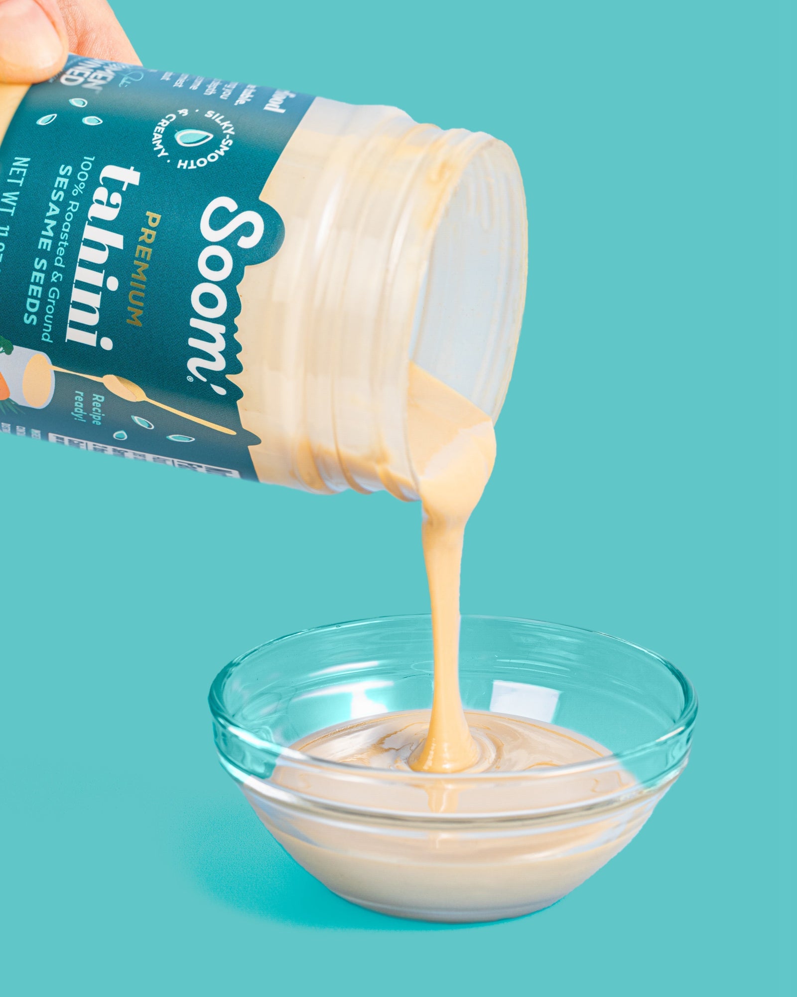 pouring tahini in bowl