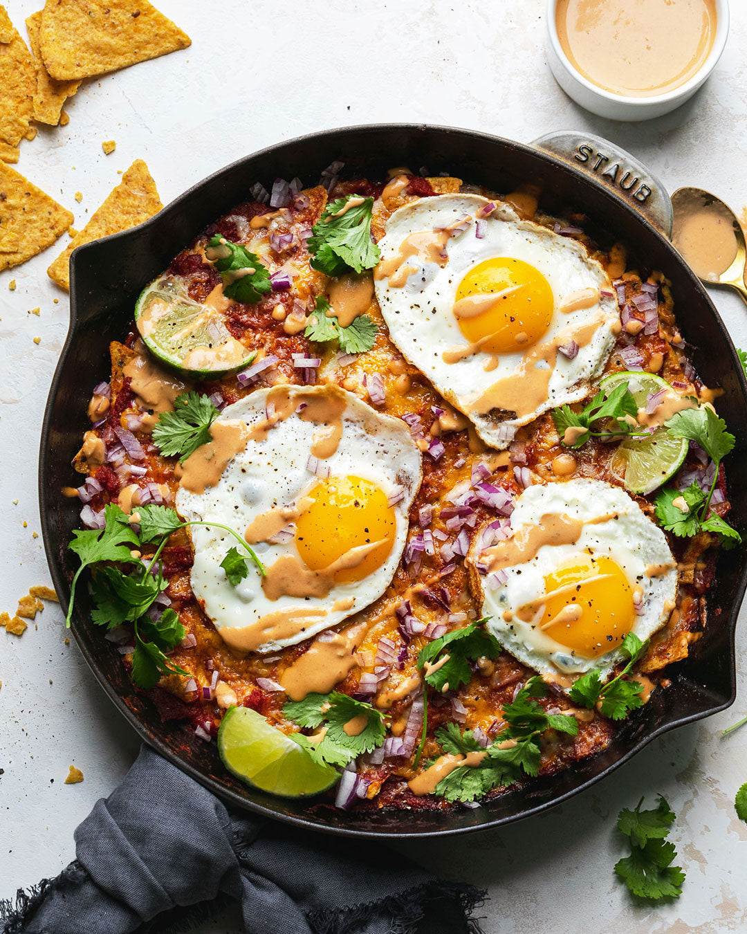 Chilaquiles with Fried Eggs and Tahini Chipotle Lime Crema